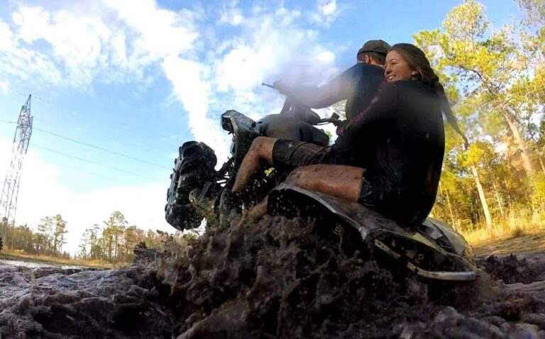 atv riders in the mud